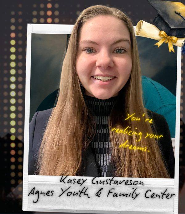 Kasey Gustaveson, Agnes Youth and Family Center, graduation photo with the handwritten note: You’re realizing your dreams.