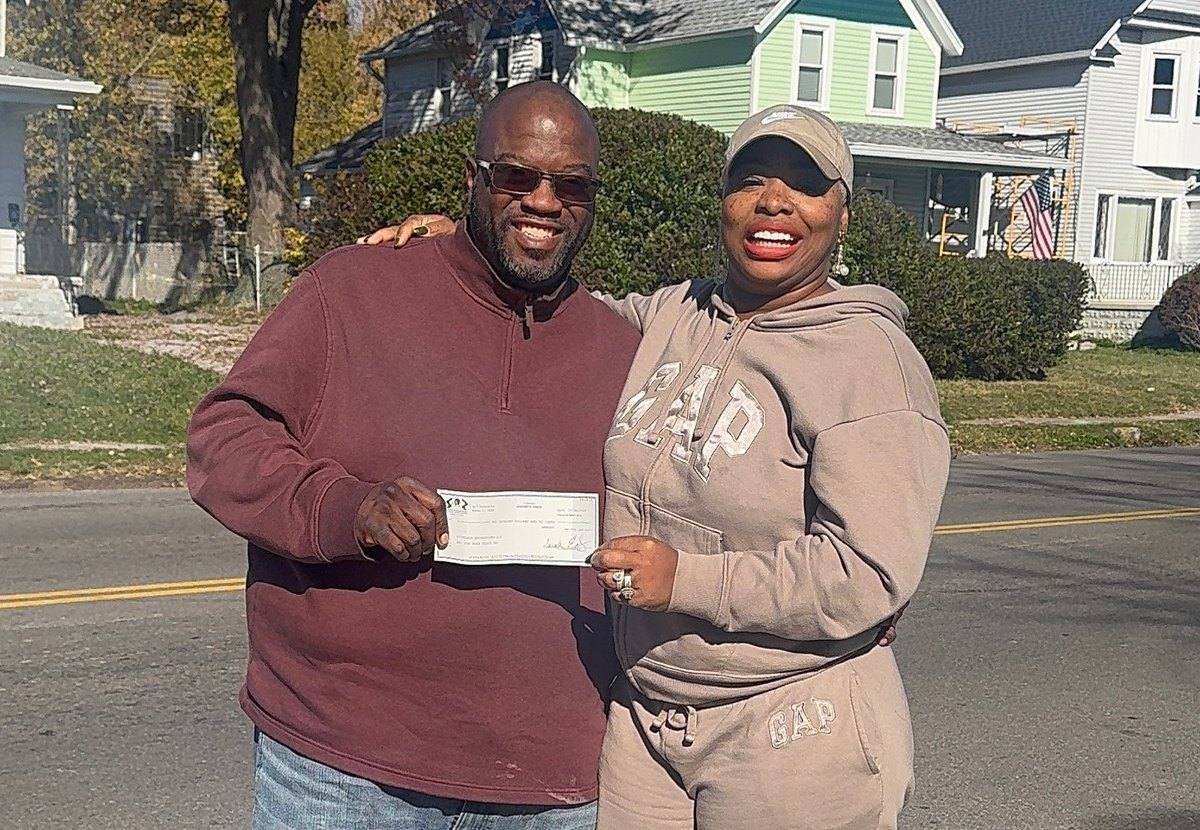 Demetrius Richards of Richards Enterprises receiving his $2,000 Capacity Building Grant check from Executive Director Talia Johnson Huff